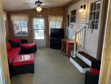 *Home Sweet Home*.Custom painted driveway flows into carport on Barefoot Bay Golf Course in Florida - for sale on GolfHomes.com, golf home, golf lot