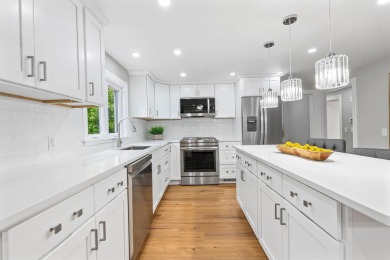 Nestled on a quiet dead-end street, this beautifully updated on Bolduc Park Golf Course in New Hampshire - for sale on GolfHomes.com, golf home, golf lot