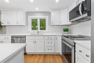 Nestled on a quiet dead-end street, this beautifully updated on Bolduc Park Golf Course in New Hampshire - for sale on GolfHomes.com, golf home, golf lot