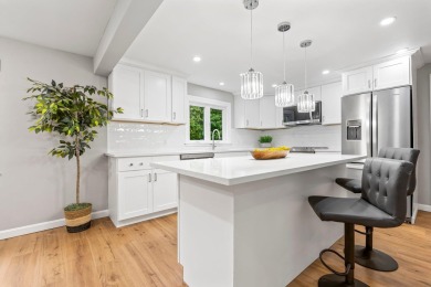 Nestled on a quiet dead-end street, this beautifully updated on Bolduc Park Golf Course in New Hampshire - for sale on GolfHomes.com, golf home, golf lot