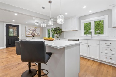 Nestled on a quiet dead-end street, this beautifully updated on Bolduc Park Golf Course in New Hampshire - for sale on GolfHomes.com, golf home, golf lot