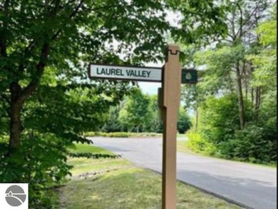 Bellaire, Michigan:  Side-by-side parcels form a private retreat on Cedar River Golf Course in Michigan - for sale on GolfHomes.com, golf home, golf lot