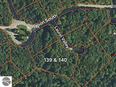 Bellaire, Michigan:  Side-by-side parcels form a private retreat on Cedar River Golf Course in Michigan - for sale on GolfHomes.com, golf home, golf lot