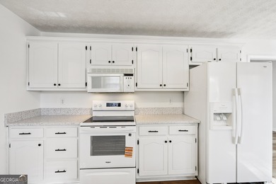 Welcome home to this cutie, updated 3-bedroom,2 bath home that on Turtle Cove Golf Course in Georgia - for sale on GolfHomes.com, golf home, golf lot