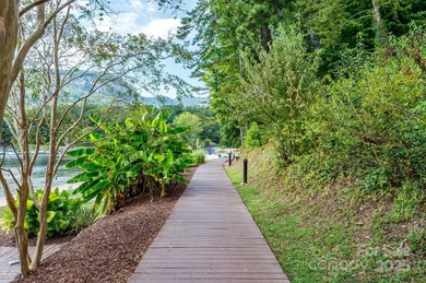 Tucked along the 8th hole of Apple Valley Golf Course, this on Rumbling Bald Resort on Lake Lure in North Carolina - for sale on GolfHomes.com, golf home, golf lot