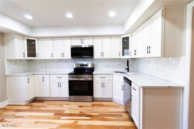 Highly desirable North Hudson condominium overlooking the 10th on The Country Club of Hudson in Ohio - for sale on GolfHomes.com, golf home, golf lot