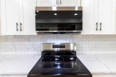 Highly desirable North Hudson condominium overlooking the 10th on The Country Club of Hudson in Ohio - for sale on GolfHomes.com, golf home, golf lot