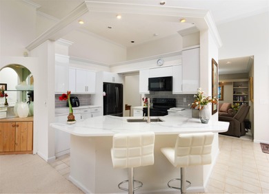 Set along the picturesque fairways of PGA National, this on PGA National Golf Club in Florida - for sale on GolfHomes.com, golf home, golf lot