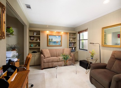 Set along the picturesque fairways of PGA National, this on PGA National Golf Club in Florida - for sale on GolfHomes.com, golf home, golf lot