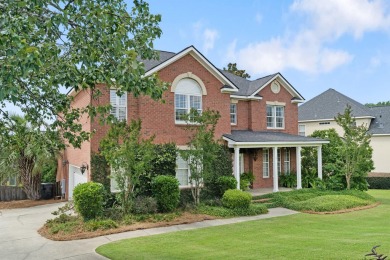 Full of charm and nestled in a quiet cul-de-sac, this 4-bedroom on West Lake Country Club in Georgia - for sale on GolfHomes.com, golf home, golf lot
