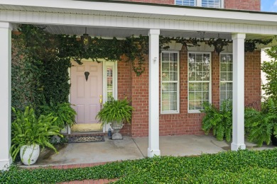 Full of charm and nestled in a quiet cul-de-sac, this 4-bedroom on West Lake Country Club in Georgia - for sale on GolfHomes.com, golf home, golf lot