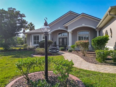 Under contract-accepting backup offers. Stunning Lakefront Home on Glenview Championship Golf and Country Club in Florida - for sale on GolfHomes.com, golf home, golf lot