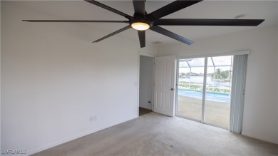 Waterfront Pool Home with Solar in exclusive Cape Coral! Welcome on El Rio Golf Course and Club in Florida - for sale on GolfHomes.com, golf home, golf lot