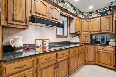 Step into timeless elegance with this beautifully crafted home on Waukon Golf and Country Club in Iowa - for sale on GolfHomes.com, golf home, golf lot