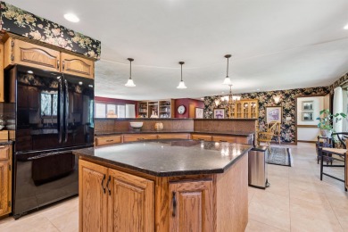 Step into timeless elegance with this beautifully crafted home on Waukon Golf and Country Club in Iowa - for sale on GolfHomes.com, golf home, golf lot