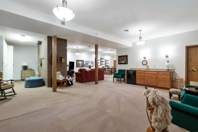 Step into timeless elegance with this beautifully crafted home on Waukon Golf and Country Club in Iowa - for sale on GolfHomes.com, golf home, golf lot