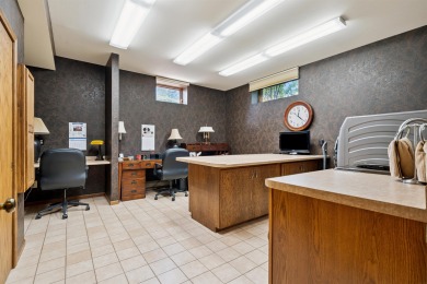 Step into timeless elegance with this beautifully crafted home on Waukon Golf and Country Club in Iowa - for sale on GolfHomes.com, golf home, golf lot
