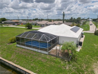 Waterfront Pool Home with Solar in exclusive Cape Coral! Welcome on El Rio Golf Course and Club in Florida - for sale on GolfHomes.com, golf home, golf lot