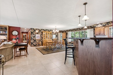 Step into timeless elegance with this beautifully crafted home on Waukon Golf and Country Club in Iowa - for sale on GolfHomes.com, golf home, golf lot