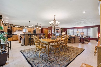 Step into timeless elegance with this beautifully crafted home on Waukon Golf and Country Club in Iowa - for sale on GolfHomes.com, golf home, golf lot