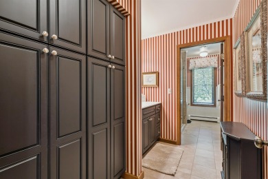 Step into timeless elegance with this beautifully crafted home on Waukon Golf and Country Club in Iowa - for sale on GolfHomes.com, golf home, golf lot