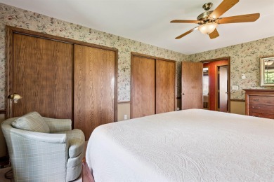 Step into timeless elegance with this beautifully crafted home on Waukon Golf and Country Club in Iowa - for sale on GolfHomes.com, golf home, golf lot