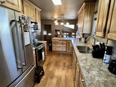 This fully remodeled two-unit condo comes with all the bells and on Miles City Town and Country Club in Montana - for sale on GolfHomes.com, golf home, golf lot
