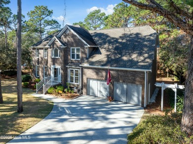 Discover this beautifully remodeled, brick traditional two-story on Oak Island Golf Club in North Carolina - for sale on GolfHomes.com, golf home, golf lot