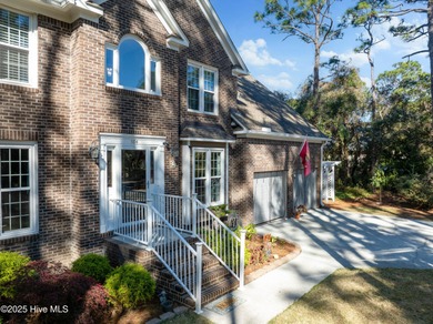 Discover this beautifully remodeled, brick traditional two-story on Oak Island Golf Club in North Carolina - for sale on GolfHomes.com, golf home, golf lot