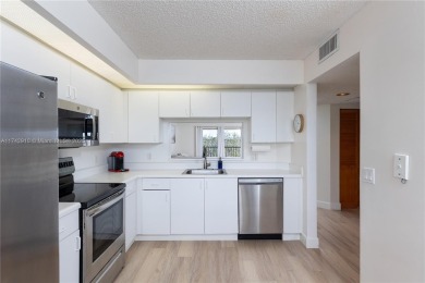 This beautifully updated 4th -floor condo offers stunning lake on Flamingo Lakes Country Club in Florida - for sale on GolfHomes.com, golf home, golf lot