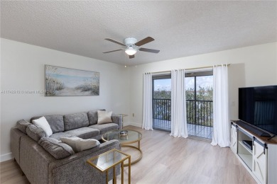 This beautifully updated 4th -floor condo offers stunning lake on Flamingo Lakes Country Club in Florida - for sale on GolfHomes.com, golf home, golf lot