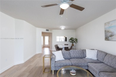 This beautifully updated 4th -floor condo offers stunning lake on Flamingo Lakes Country Club in Florida - for sale on GolfHomes.com, golf home, golf lot