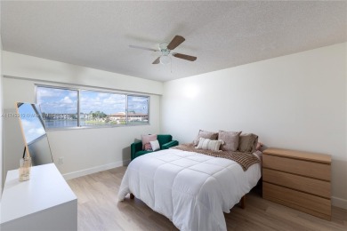 This beautifully updated 4th -floor condo offers stunning lake on Flamingo Lakes Country Club in Florida - for sale on GolfHomes.com, golf home, golf lot