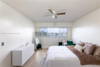 This beautifully updated 4th -floor condo offers stunning lake on Flamingo Lakes Country Club in Florida - for sale on GolfHomes.com, golf home, golf lot