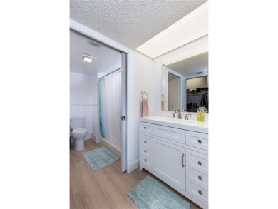This beautifully updated 4th -floor condo offers stunning lake on Flamingo Lakes Country Club in Florida - for sale on GolfHomes.com, golf home, golf lot