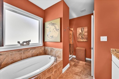 Enjoy true lock and go living in this beautiful gated, lakefront on The Patriot Golf Club At Grand Harbor in South Carolina - for sale on GolfHomes.com, golf home, golf lot