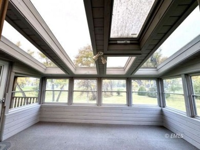 This charming raised ranch home sits on a quiet cul-de-sac that on Miles City Town and Country Club in Montana - for sale on GolfHomes.com, golf home, golf lot