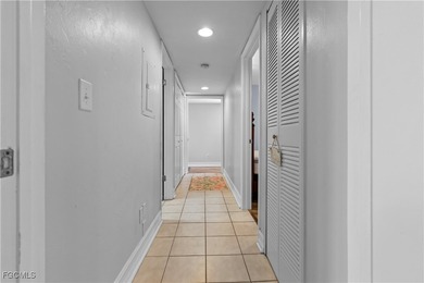 This spacious corner end unit delivers the South Florida on Hideaway Country Club in Florida - for sale on GolfHomes.com, golf home, golf lot