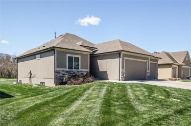 Enjoy low-maintenance living with golf course views in this on Teetering Rocks Links in Missouri - for sale on GolfHomes.com, golf home, golf lot