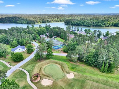 Enjoy true lock and go living in this beautiful gated, lakefront on The Patriot Golf Club At Grand Harbor in South Carolina - for sale on GolfHomes.com, golf home, golf lot