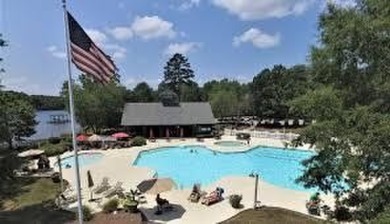 Enjoy true lock and go living in this beautiful gated, lakefront on The Patriot Golf Club At Grand Harbor in South Carolina - for sale on GolfHomes.com, golf home, golf lot