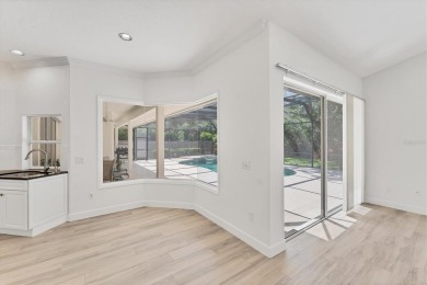 Prepare to fall in love with this exquisite 4-bedroom on Laurel Oak Country Club in Florida - for sale on GolfHomes.com, golf home, golf lot