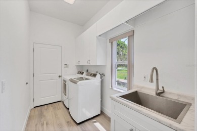 Prepare to fall in love with this exquisite 4-bedroom on Laurel Oak Country Club in Florida - for sale on GolfHomes.com, golf home, golf lot