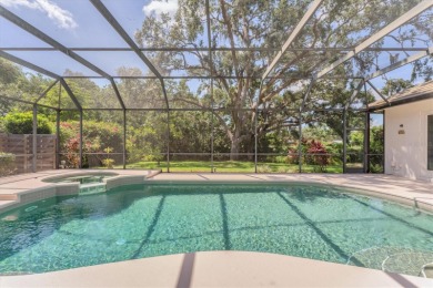 Prepare to fall in love with this exquisite four-bedroom on Laurel Oak Country Club in Florida - for sale on GolfHomes.com, golf home, golf lot
