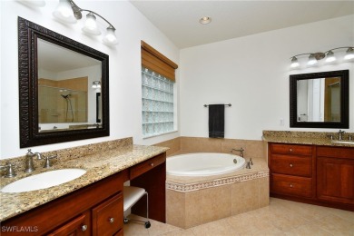 You must see this elegantly appointed home with its open floor on Estero Country Club in Florida - for sale on GolfHomes.com, golf home, golf lot