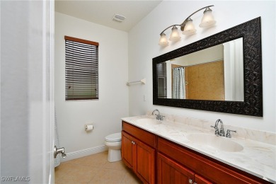 You must see this elegantly appointed home with its open floor on Estero Country Club in Florida - for sale on GolfHomes.com, golf home, golf lot