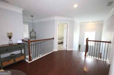 Enter this tranquil retreat that exudes a quiet elegance.  Step on Berkeley Hills Country Club in Georgia - for sale on GolfHomes.com, golf home, golf lot