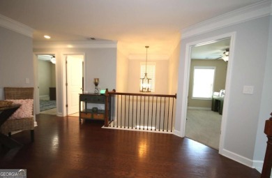 Enter this tranquil retreat that exudes a quiet elegance.  Step on Berkeley Hills Country Club in Georgia - for sale on GolfHomes.com, golf home, golf lot