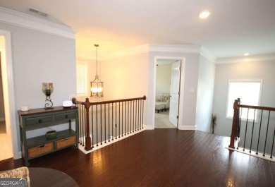 Enter this tranquil retreat that exudes a quiet elegance.  Step on Berkeley Hills Country Club in Georgia - for sale on GolfHomes.com, golf home, golf lot