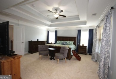 Enter this tranquil retreat that exudes a quiet elegance.  Step on Berkeley Hills Country Club in Georgia - for sale on GolfHomes.com, golf home, golf lot